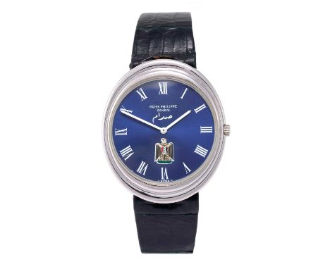 Patek Philippe: A Rare 18 Carat White Gold Oval-Shaped Automatic Wristwatch with Iraqi Coat of Arms Eagle of Saladin Crested 