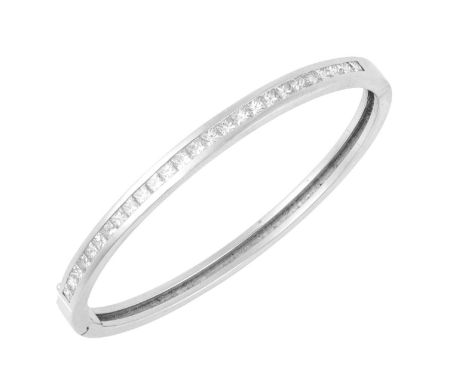 An 18 Carat White Gold Diamond Banglethe twenty-six princess cut diamonds in a channel setting, to a plain polished hinged ba