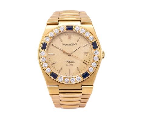 IWC: An 18 Carat Gold Sapphire and Diamond Set Calendar Centre Seconds Quartz "Jumbo" Size Wristwatch, signed International W