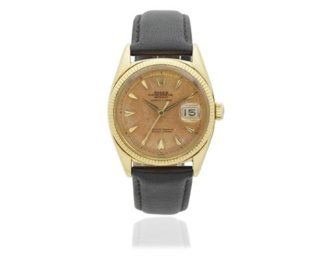Rolex. An 18K gold automatic calendar wristwatch with roulette date wheel and retailed by Serpico Y LainoModel: DatejustRefer