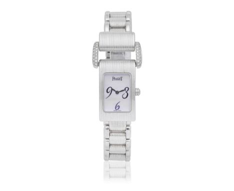 Piaget. A lady's 18K white gold and diamond set quartz bracelet watch with mother of pearl dialModel: Miss ProtocoleReference