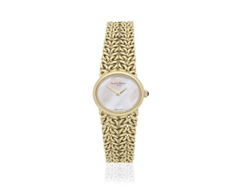 Baume &amp; Mercier. A lady's 18K gold manual wind oval bracelet watch with mother of pearl dialReference: 38331Date: Circa 1