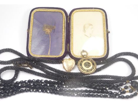 Two jet bead necklaces, a memorial photograph c.1870,&nbsp; another with gold and enamel back and a locket. 