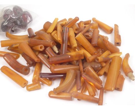 Quantity of amber pipe and cigarette holder mouthpieces.&nbsp;345g. 