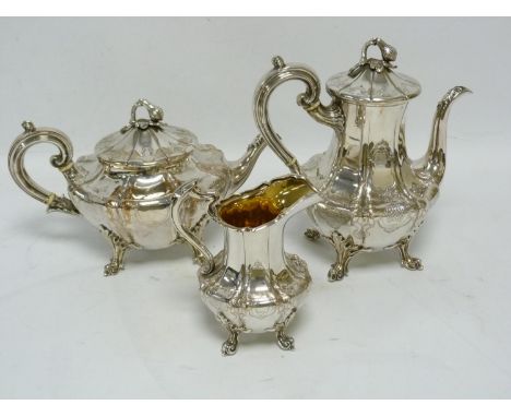 E.p three piece tea set, comprising of a tea pot, milk jug and sugar bowl, all having repousse scroll and floral design,the j