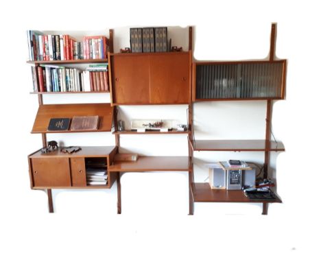 1960's Danish Modular Teak Wall Unit in the manner of Poul Cadovius. Consisiting of wall mounted support rails each with 32 b