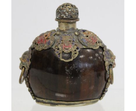 Oriental hardwood snuff bottle of elliptical form with moulded metal mounts, twin lion mask ring handles and traces of polych