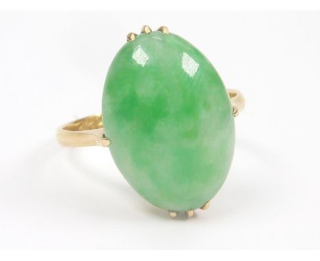 Chinese jadeite ring, oval cabochon approx. 16mm x 11mm x 4mm in gold. Size 'O'. Condition report:Good condition. Chinese cha