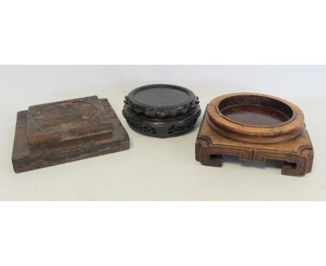 Antique Chinese hardwood stand of square form with carved key pattern feet, 20cm wide (to fit item approx. 14cm diam.); anoth