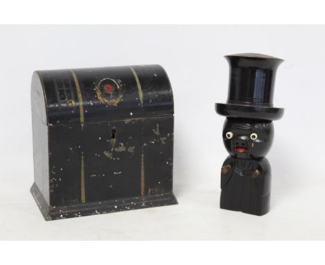 Japanese ebonised wooden Kobi toy dice shaker in the form of a figure with large top hat and comical protruding bone eyes, 17