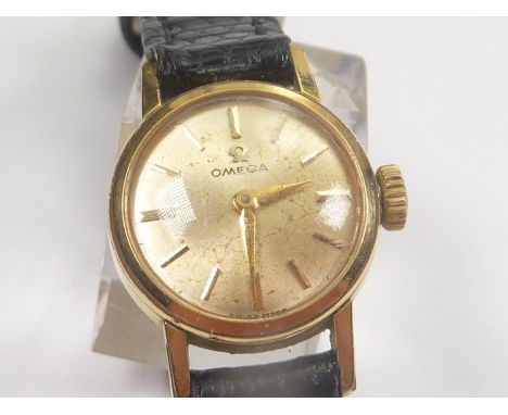 Lady's Omega rolled gold watch, manual, on strap. Going. 
