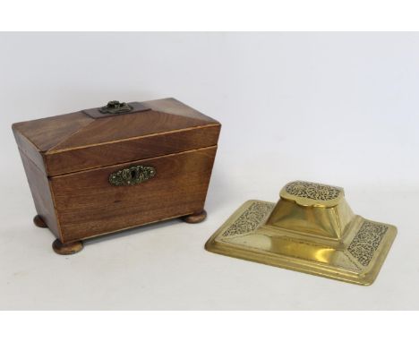 19th Century mahogany tea caddy of sarcophagus form, 21cm wide, unfitted interior, also a brass desk stand with inkwell, 20cm