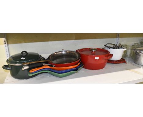 Two shelves of domestic wares including cast iron pans, fish kettle, storage jars, ice buckets, salad bowl (qty). Shelf 86 an