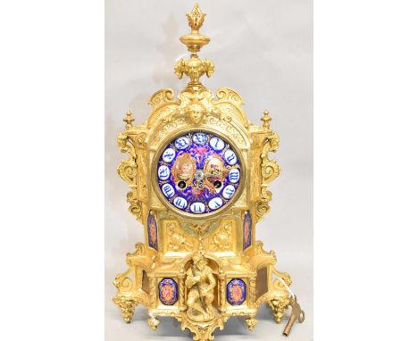 A late 19th century French ormolu mantel clock with enamel dial and inset enamel panels, height 24cm, with key.Condition Repo