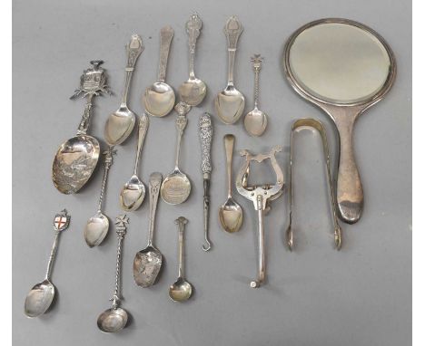 A group of hallmarked silver or white metal small silver including a pair of sugar tongs, commemorative spoons, teaspoons, dr