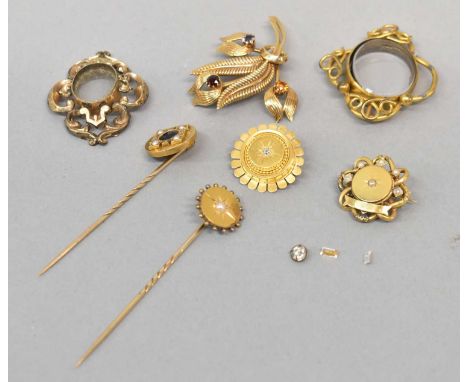 A small group of jewellery including a 9ct yellow gold gem set floral brooch (8.7g), two yellow metal stick pins, two small y