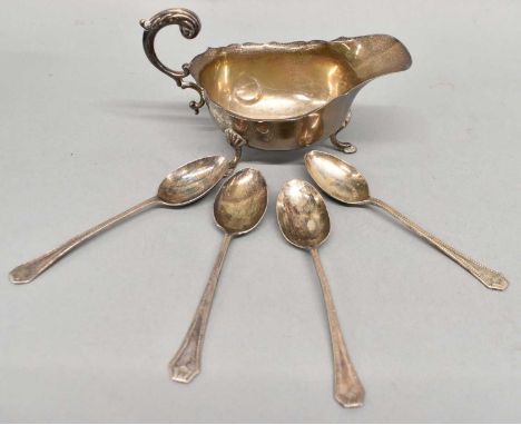 A Birmingham hallmarked silver sauceboat and a set of four teaspoons, combined approx 4.6ozt/145g.