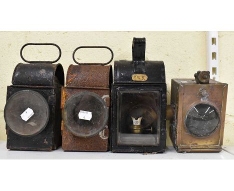 RAILWAYANA; South West Railway lamp complete with burner and with black painted frame, height 26cm, a three further railway l