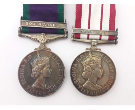 Two Queen Elizabeth II medals: a Campaign Service Medal '24030868-SIG. R. J. TAYLOR. R. SIGS.' with South Arabia bar and a Na