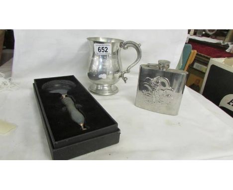 A Pontin's trophy tankard, a hip flask and a magnifying glass.