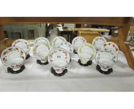 A set of 12 'Bloemen Van Netherland' floral decorated tea cups and saucers with stands (1 cup chipped).&nbsp;&nbsp;(Collect o