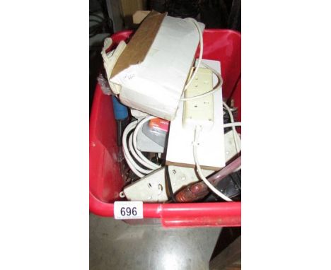 A box of tools, extension leads etc., *condition report*2 extension leads, one attached to wood, one a/f