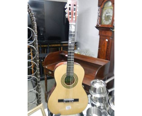 An acoustic guitar.&nbsp;&nbsp;(Collect only).