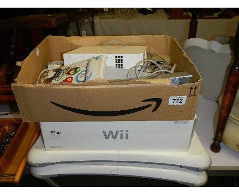 A Wii console and accessories.  (Collect only). *condition report*Power light comes on when plugged on