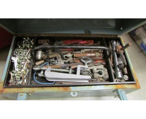 A tool box and assorted tools.