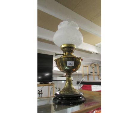 A brass oil lamp with later shade.&nbsp;&nbsp;(Collect only).