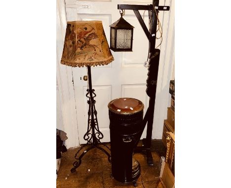 A 20th century oak standing lamp in design as a street lamp, another metal standing lamp; others (3)