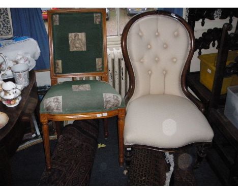 A Victorian mahogany balloon back armchair with button down upholstery, on turned tapering legs and a Victorian style dining 