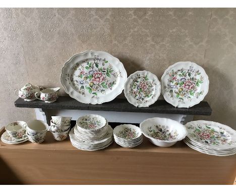 A Royal Doulton 'Monmouth' pattern D. 6195 tea and dinner set to include 6 cups (one with hairline crack), 6 saucers, 6 side 