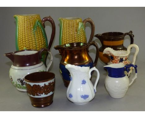 A group of 19th C jugs and a beaker , consisting of 2 corn on a cob majolica jugs , 2 copper lustre jugs , hunting scene jug 