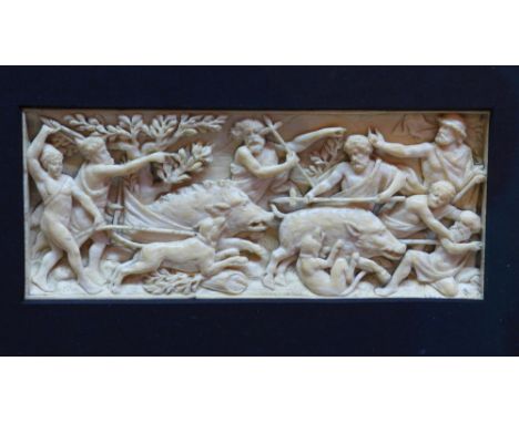 A 19th century Continental carving of a boar hunting scene. H.5.5cm W.14cm 