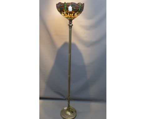 A Tiffany style standard lamp with stained lead glass shade decorated with dragon flies. 