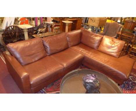 A brown leather corner sofa