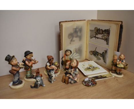 An interesting album of mainly Hummel postcards (90 approximately) c1950 onwards, sold alongside six Goebal 'Hummel' porcelai