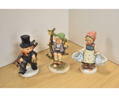 A group of three Goebel porcelain 'Hummel' figures and figurines, comprising 'Chimney Sweep with Ladder' , 'Apple Tree Boy' a