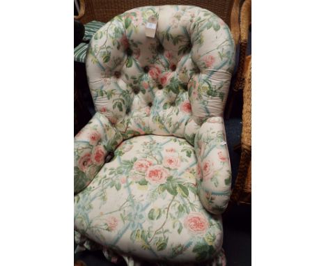 A Victorian button-back nursing chair having floral upholstery  Caster is off typical turned squat legs to front saber style 