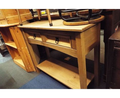 A pine console table with two short drawers above an under tier