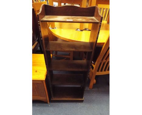 An oak low five-shelf bookcase