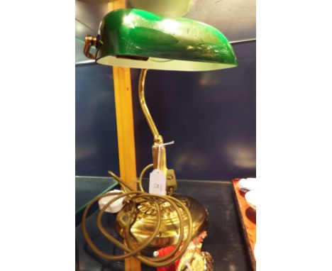A banker's desk lamp with green shade