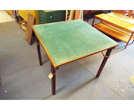 An Edwardian folding card table