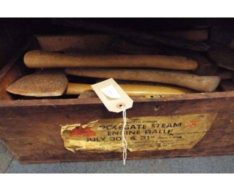 A box of vintage axes and choppers