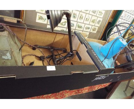 Four assorted vintage industrial lamps