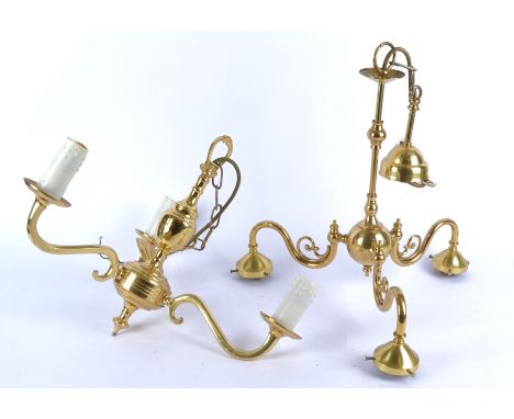 A brass hanging electric light fitting, with three scrolling arms and white glass light shades, a matching pair of wall sconc