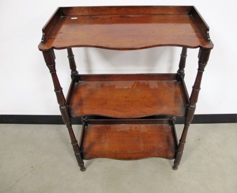 William VI mahogany three tier whatnot,  gallery back, shaped shelf fronts, raised on round turned supports, 61cm x 31cm x 89