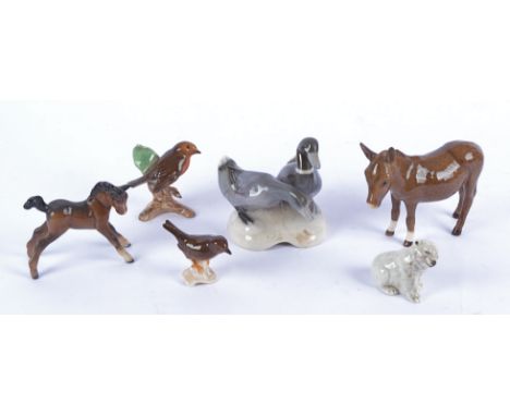 A selection of ceramic animals, comprising a Beswick donkey and pony, a British polar bear and three Goebel models of birds (