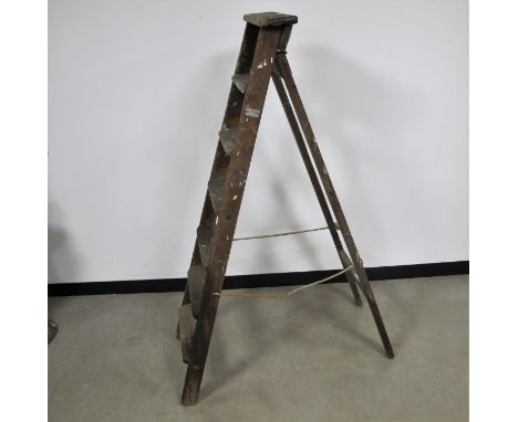 A vintage wooden pitch pine step ladder, six steps, labelled  Drew Clarke and Co., Diamond Ladder, Works, London E.10 